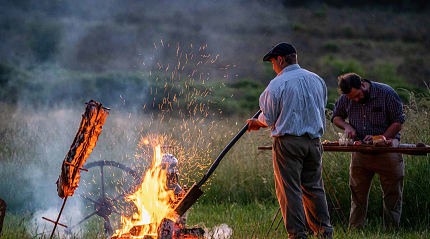 Gauchos preparing asado in Argentina