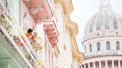Couple on a balcony in Havana, Cuba