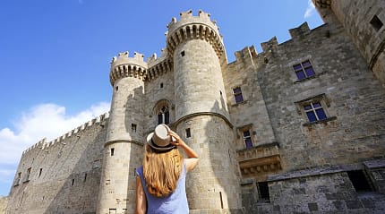 Woman visiting the Palace of the Grand Master of the Knights in Rhodes, Greece