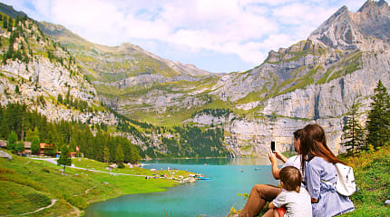 Family photographing nature in Switzerland