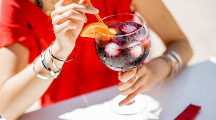 Woman drinking sangria in Barcelona, Spain