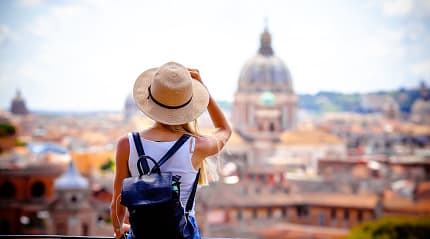 Woman enjoying the view of the Vatican in Rome, Italy