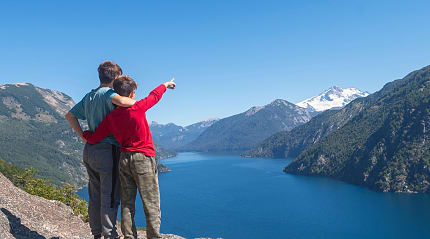 Kids enjoying the view of lake and mountains in Bariloche, Argentina