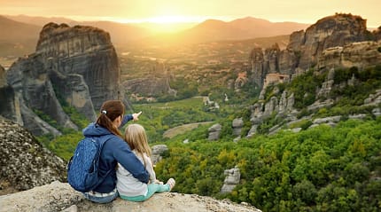 Mother and daughter exploring Meteora valley in Greece