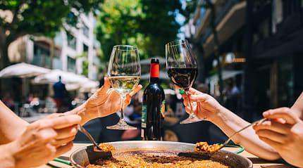 Spanish paella and wine served at a restaurant