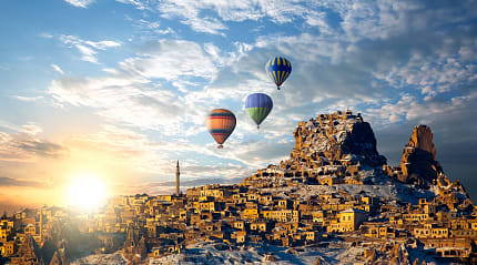 Hot air balloons flying over spectacular Cappadocia in Turkey