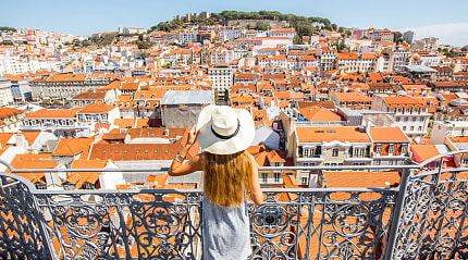 Female traveler at overlook in Lisbon, Portugal