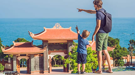 Family at Ho Quoc Pagoda entrance doors, Phu Quoc, Vietnam