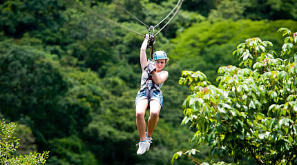 Young girl ziplining in Costa Rica
