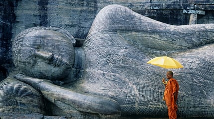 Buddhist Monk at The Gal Vihara in Polonnaruwa, Sri Lanka.
