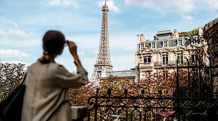 Woman admiring the Eiffel Tower, Paris.