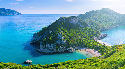 Porto Timoni, the secluded double beach near Afionas village, on the west coast of Corfu island in Greece.