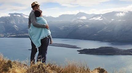 Couple enjoying the view in Queenstown, New Zealand 