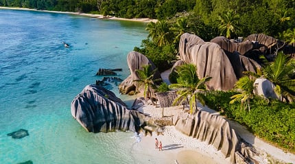 Couple at Anse Source d'Argent Beach on La Digue Island, Seychelles