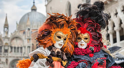 Masked revelers at Carnival in Venice, Italy