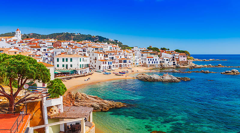 Luxury 2- Week City Highlights Tour of Spain and Portugal Blue bay and beach of Coastal town of Calella de Palafrugell in the Costa Brava Region of Spain