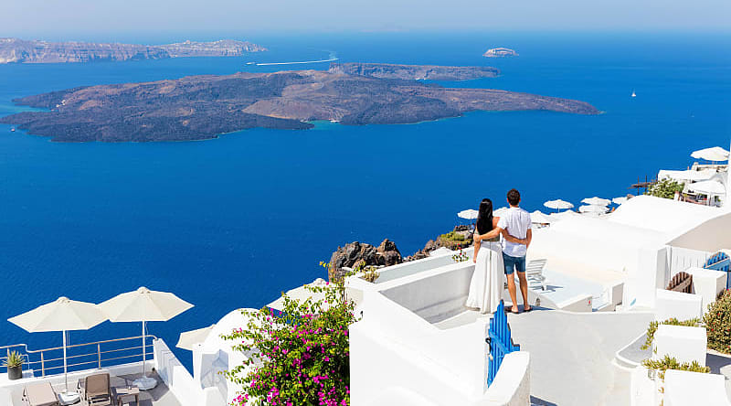 Santorini, Greece Couple enjoying the view in Santorini, Greece