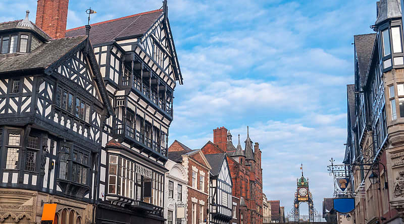 Half-timbered buildings with the Eastgate and Eastgate Clock in the old city of Chester, England Half-timbered buildings with the Eastgate and Eastgate Clock in the old city of Chester, England