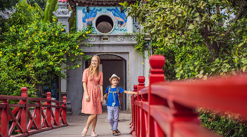 Hanoi, Vietnam Mother and son on the Hoan Keim Lake Bridge in Hanoi, Vietnam