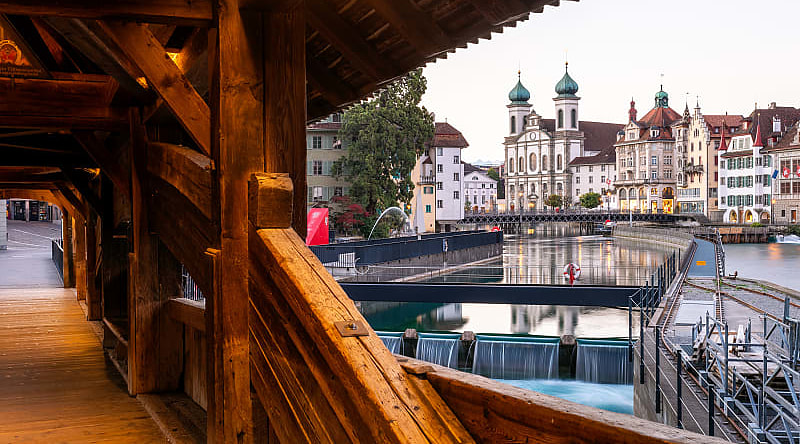 Jesuitenkirche (church right) taken from inside the Spreuerbrücke in Lucerne, Switzerland. Jesuitenkirche (church right) taken from inside the Spreuerbrücke in Lucerne, Switzerland.