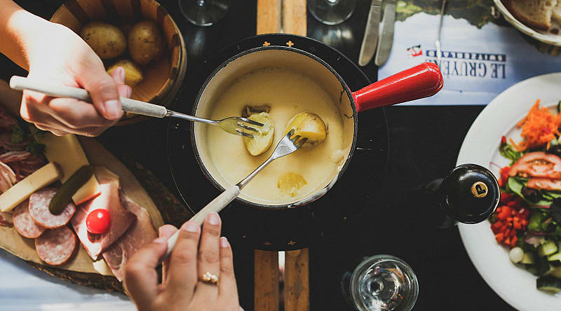 Swiss cheese fondue in Gruyères, Switzerland. Swiss cheese fondue in Gruyères, Switzerland.
