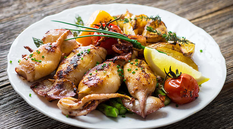 Grilled squids dish served at a restaurant in Croatia Grilled squids dish served at a restaurant in Croatia