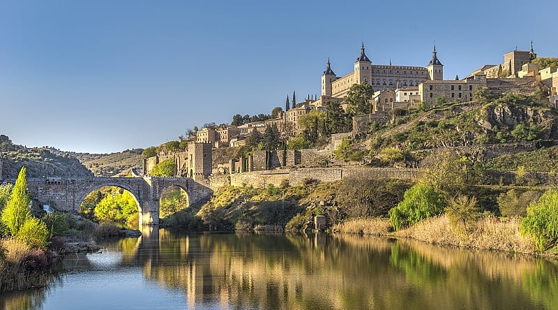 Toledo, Spain Bridge and river in Toledo, Spain with the Alcazar fortification in background