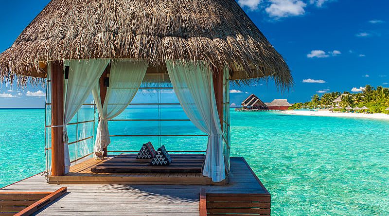 Bungalows over turquoise water in Bora Bora