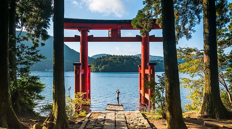 A Torii gate by lake in Hakone, Japan. A Torii gate by lake in Hakone, Japan.