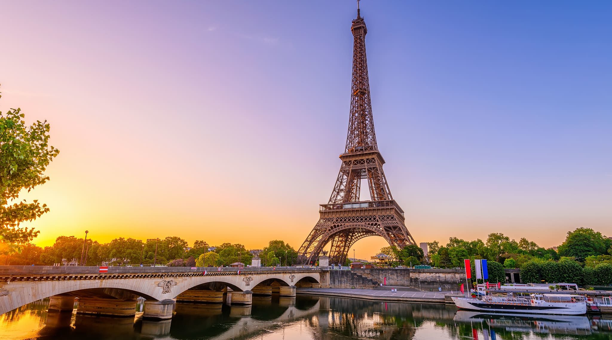 A river cruise on the Seine passing by the Eiffel Tower. A river cruise on the Seine passing by the Eiffel Tower.
