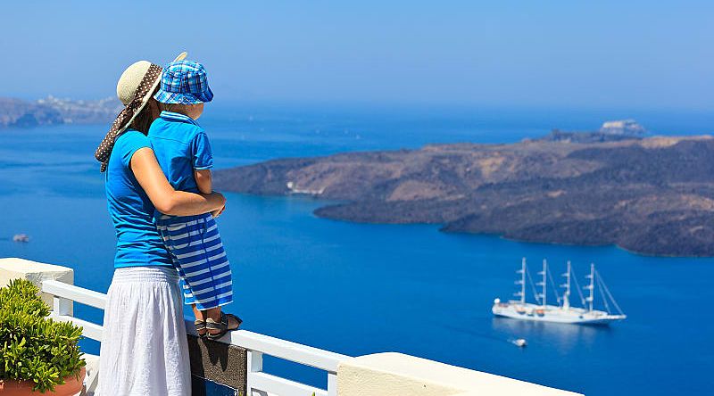 Tourists on the waterfront of Santorini, Greece