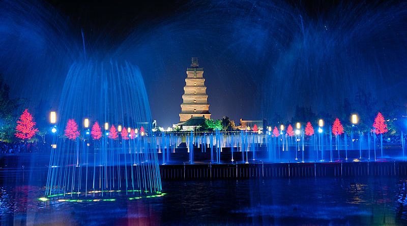 Illuminated water show at 1300-year-old Wild Goose Pagoda in Xian, China.
