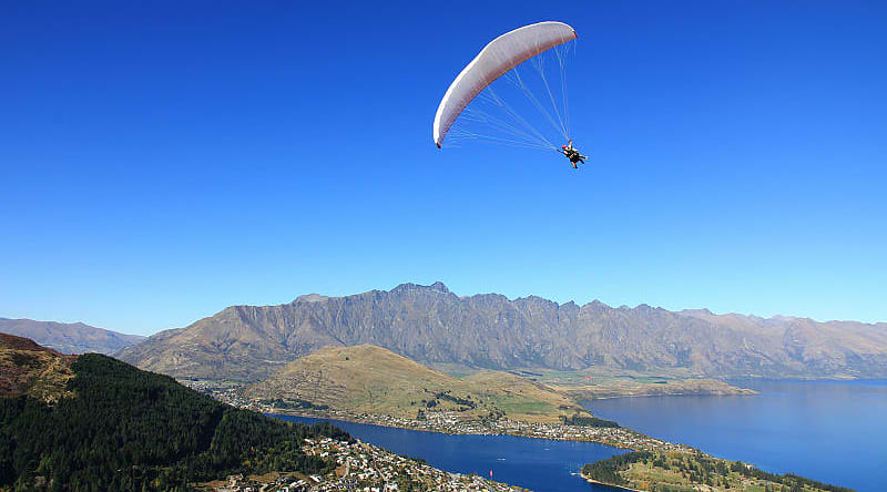 Hang glider over Queenstown South Island, New Zealand Hang glider over Queenstown South Island, New Zealand