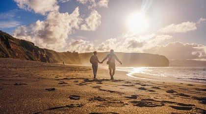 Couple walking on the beach in Sao Miguel, Azores, Portgal
