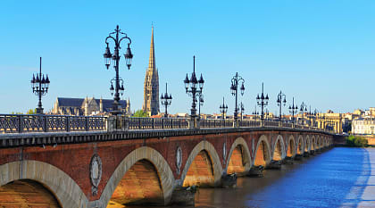 Bordeaux river bridge with St. Michel Cathedral in France