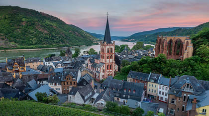 Parish Church of St. Peter surrounded by local homes and vineyards Bacharach, Germany during sunset. Parish Church of St. Peter surrounded by local homes and vineyards Bacharach, Germany during sunset.
