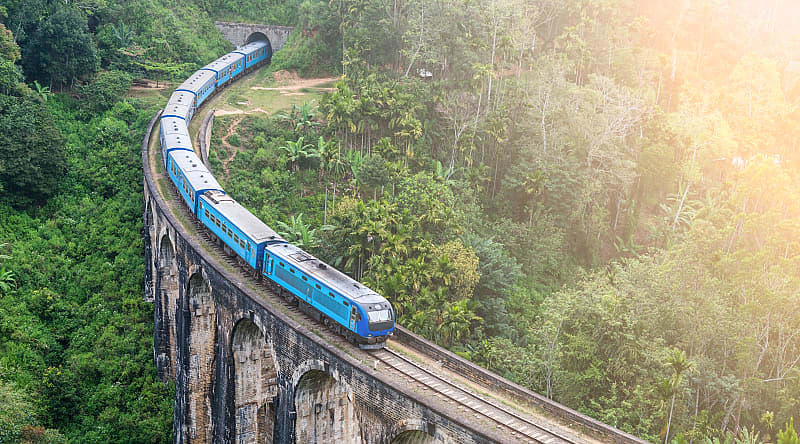 Train goes through jungle in Sri Lanka Train goes through jungle in Sri Lanka