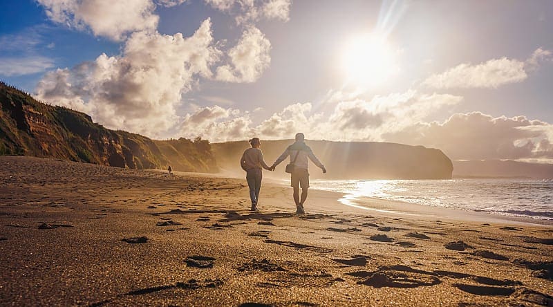 Sao Miguel Island in the Azores, Portugal Couple walking on the beach in Sao Miguel, Azores, Portgal