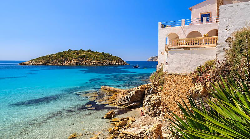 Traditional villa overlooks the ocean in Majorca.