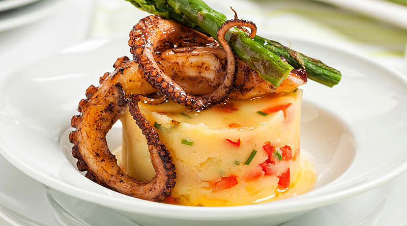 Grilled octopus served at a restaurant in San Sebastian, Spain. Grilled octopus served at a restaurant in San Sebastian, Spain.