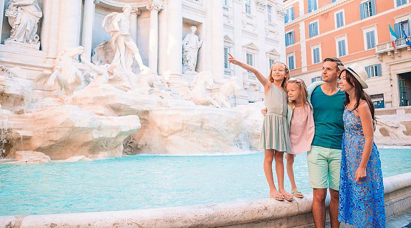 Family at at Trevi Fountain in Rome, Italy