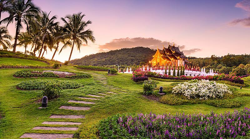 Pathway through gardens leading to Kor Khum Luang Temple at Royal Park Rajapruek in Chiang Mai, ThailandqPathway through gardens leading to Kor Khum Luang Temple at Royal Park Rajapruek in Chiang Mai, Thailand