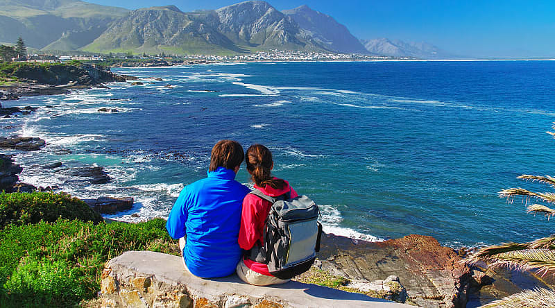 Old Harbor, Hermanus Happy couple looks at the beautiful view of the Old Harbor, Hermanus