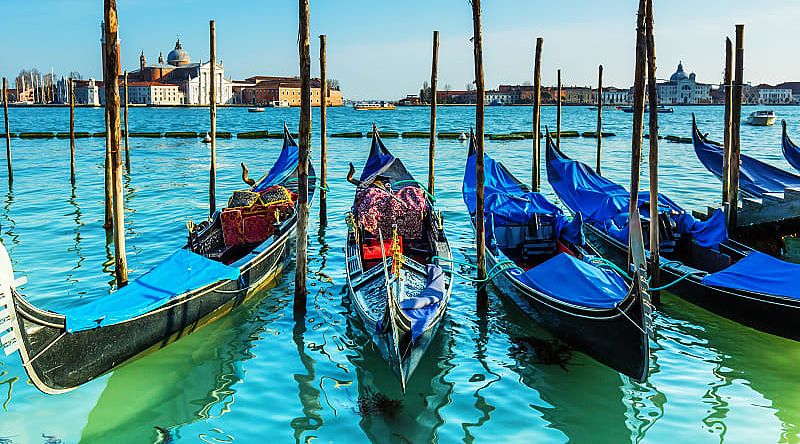 Gondolas on Venice canal in Italy Gondolas on Venice canal in Italy