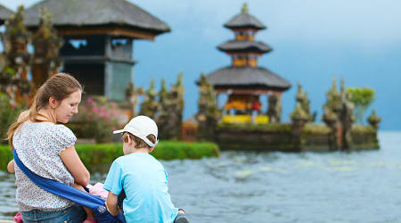 Mother and kids at Bratan Water Temple in Bali, Indonesia