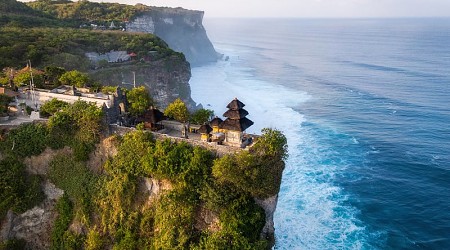 Cliffside Pura Luhur Uluwatu Temple at sunrise in Bali, Indonesia