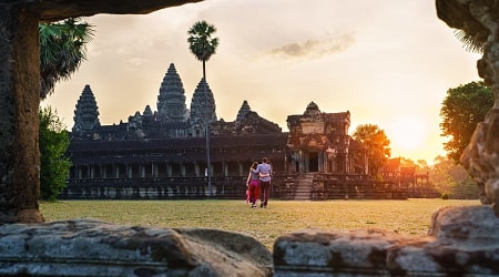 Couple walking thru Angkor Wat in Siem Reap, Cambodia