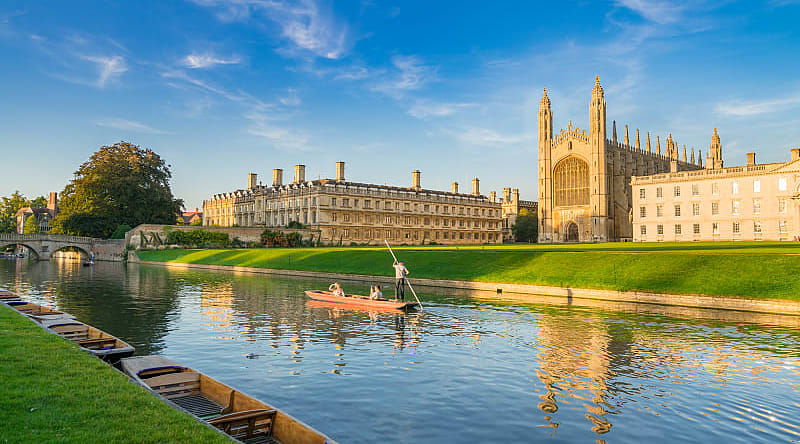 Couple punting on Cam River in Cambridge, England