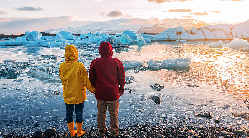 couple at Jokulsarlon Glacier Lagoon in Iceland