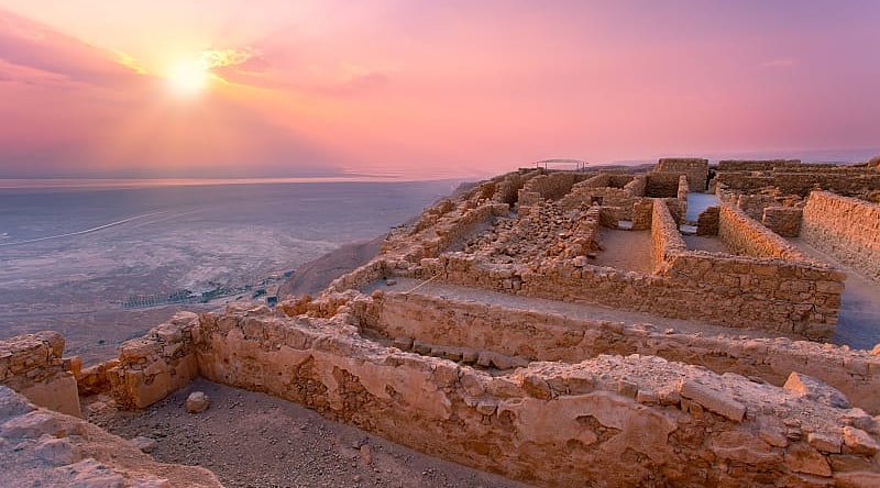 Sunset over Masada fortress in Judaea desert, Israel
